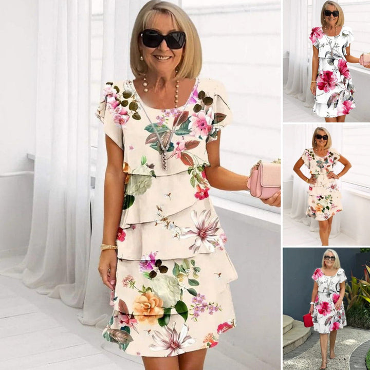 LYRA I MEHRLAGIGES GEBLÜMTES KLEID