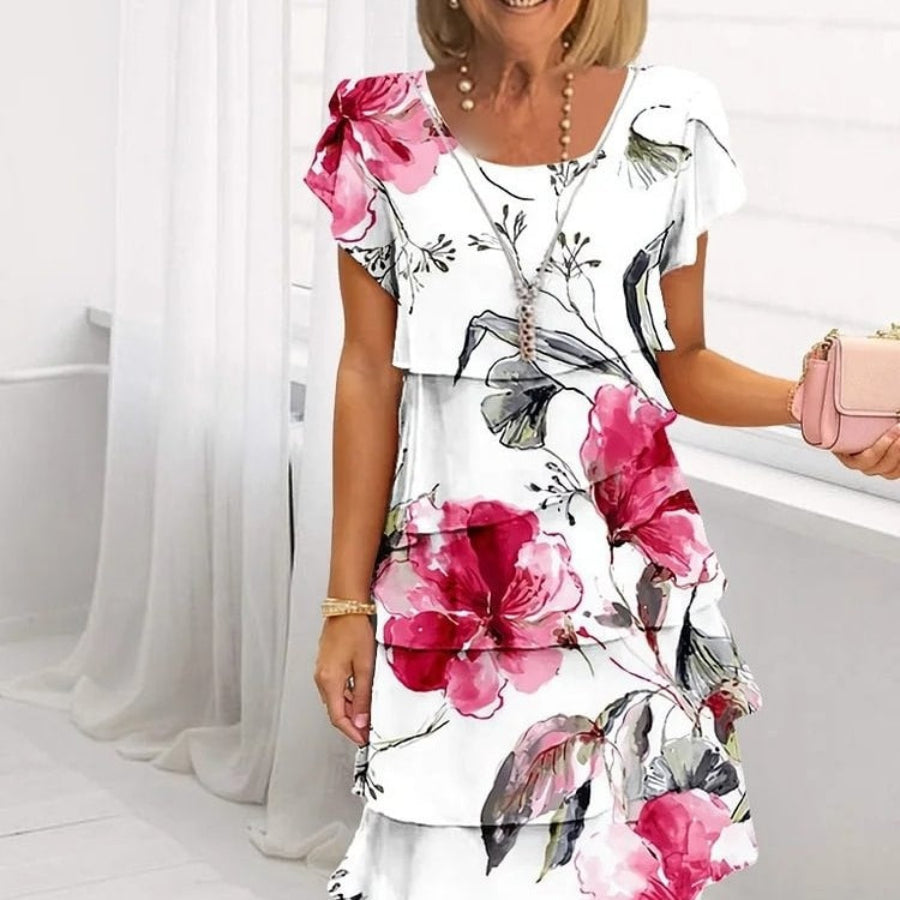 LYRA I MEHRLAGIGES GEBLÜMTES KLEID