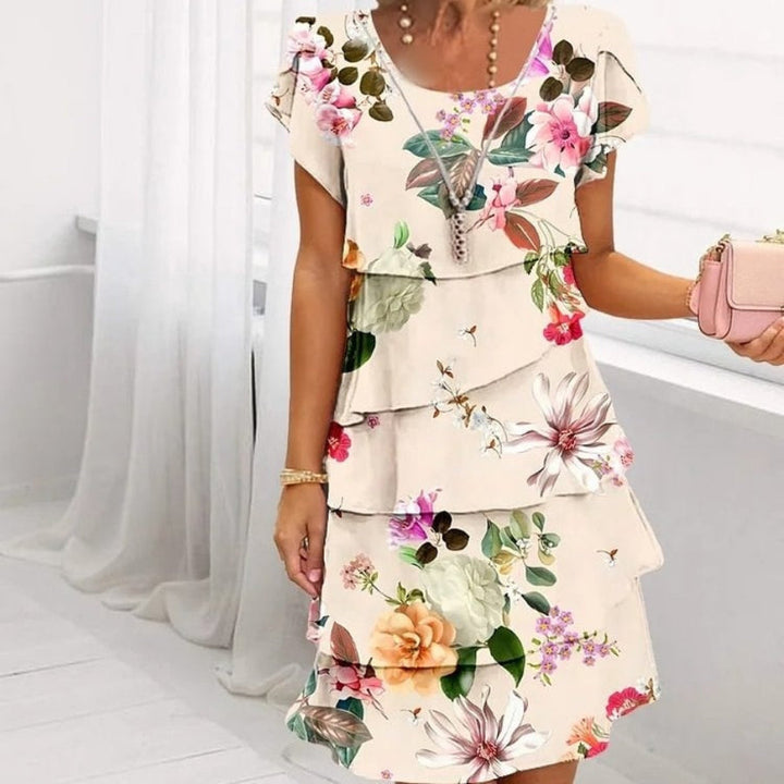 LYRA I MEHRLAGIGES GEBLÜMTES KLEID
