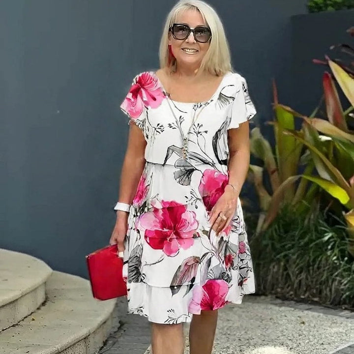 LYRA I MEHRLAGIGES GEBLÜMTES KLEID